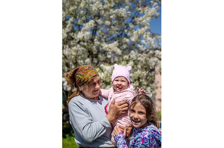 Grandmother holds her granddaughter, a Person Photo by yanadjana