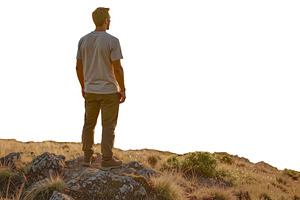 Man standing alone at sunrise on a hilltop isolated photo, a Person Photo by DanFLCreativo