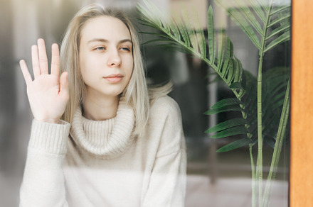 Sad girl near window thinking about something, a Person Photo by Olena Rudo