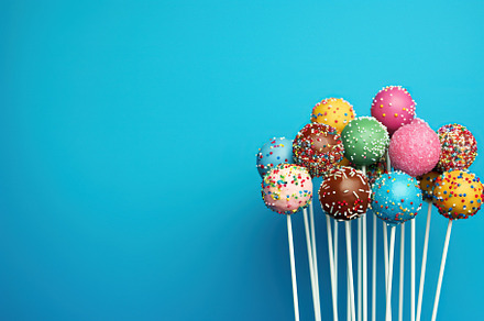 Cake pops on blue background, a Food & Drink Photo by AlyaAnd