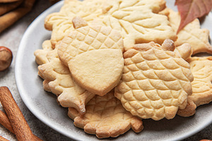 Autumn cookies on plate with cinnamon and hazelnuts, a Food & Drink Photo by Olena Rudo
