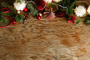 Rustic Christmas border with paper ornaments, vintage glass fini, a Photo by Sonjachni