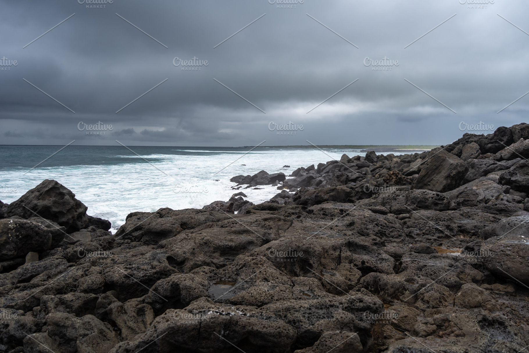 Calm seascape with rocks at Playa Loberia, San Cristobal, a Nature Photo by GoodGoods
