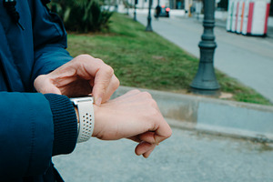 man activating the GPS tracker on his smartwatch, a Photo by Nito