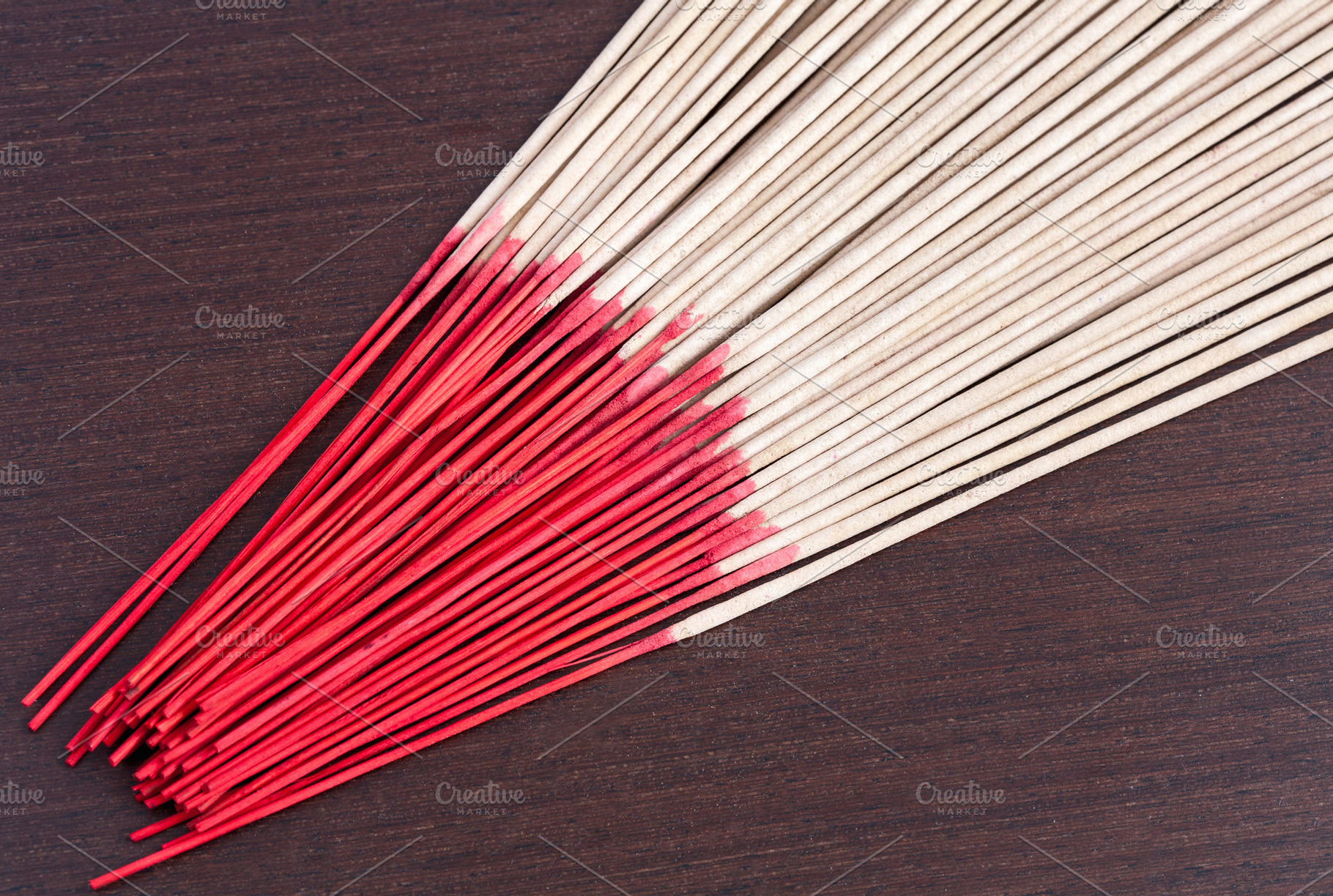Incense aromatic sticks on wooden background, an Abstract Photo by Artsaba Family