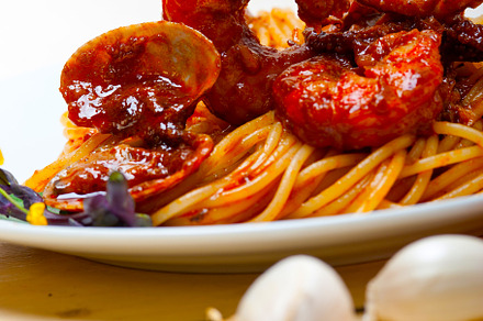 Italian seafood spaghetti pasta on red tomato sauce, a Food & Drink Photo by keko64