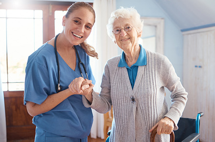 Holding hands, portrait and nurse with a senior woman after medical consultation in a nursing facility. Healthcare, support and caregiver or doctor doing a checkup on elderly lady in retirement home., a Photo by Peopleimages.com