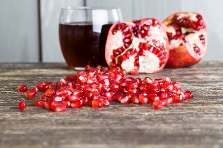 red and ripe fruit pomegranate with red grains, a Photo by MyPhotos