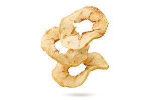 Pieces of dried apples flying on a, a Food & Drink Photo by innakreativ