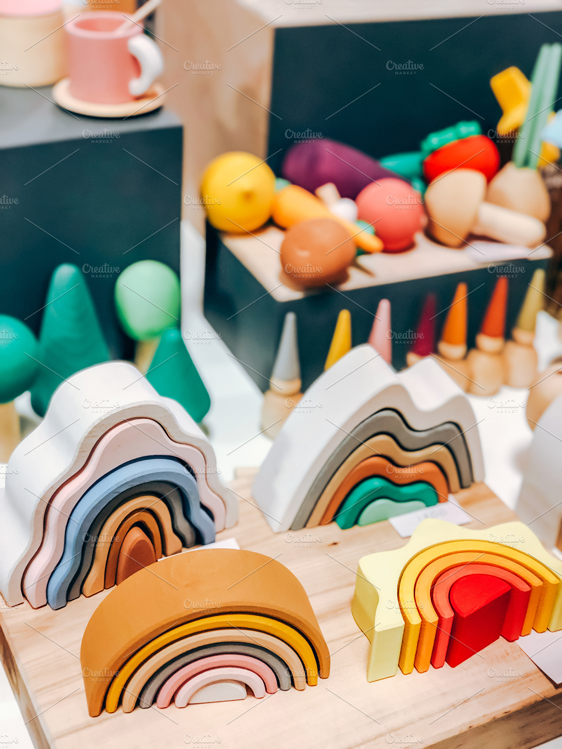 Colorful wooden rainbow toys, a Photo by Dvoevnore photos