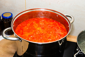 Tomato sauce in big cooking pot, a Food & Drink Photo by Vapi