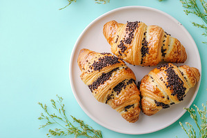 French pastry croissants with chocolate, a Food & Drink Photo by AlyaAnd