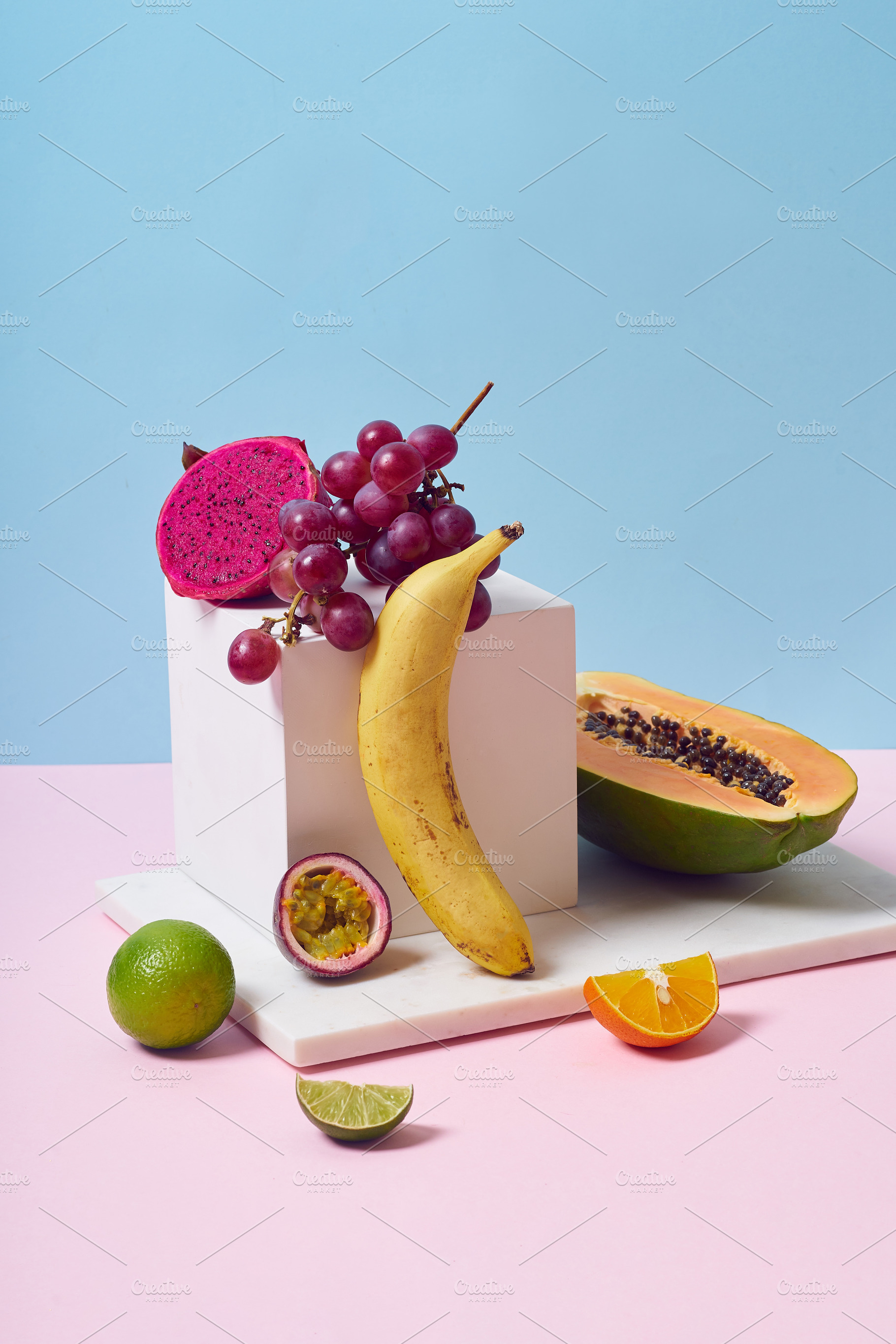 Tropical fruits variety on a colorful background. Side view with, a Food & Drink Photo by Asya Nurullina