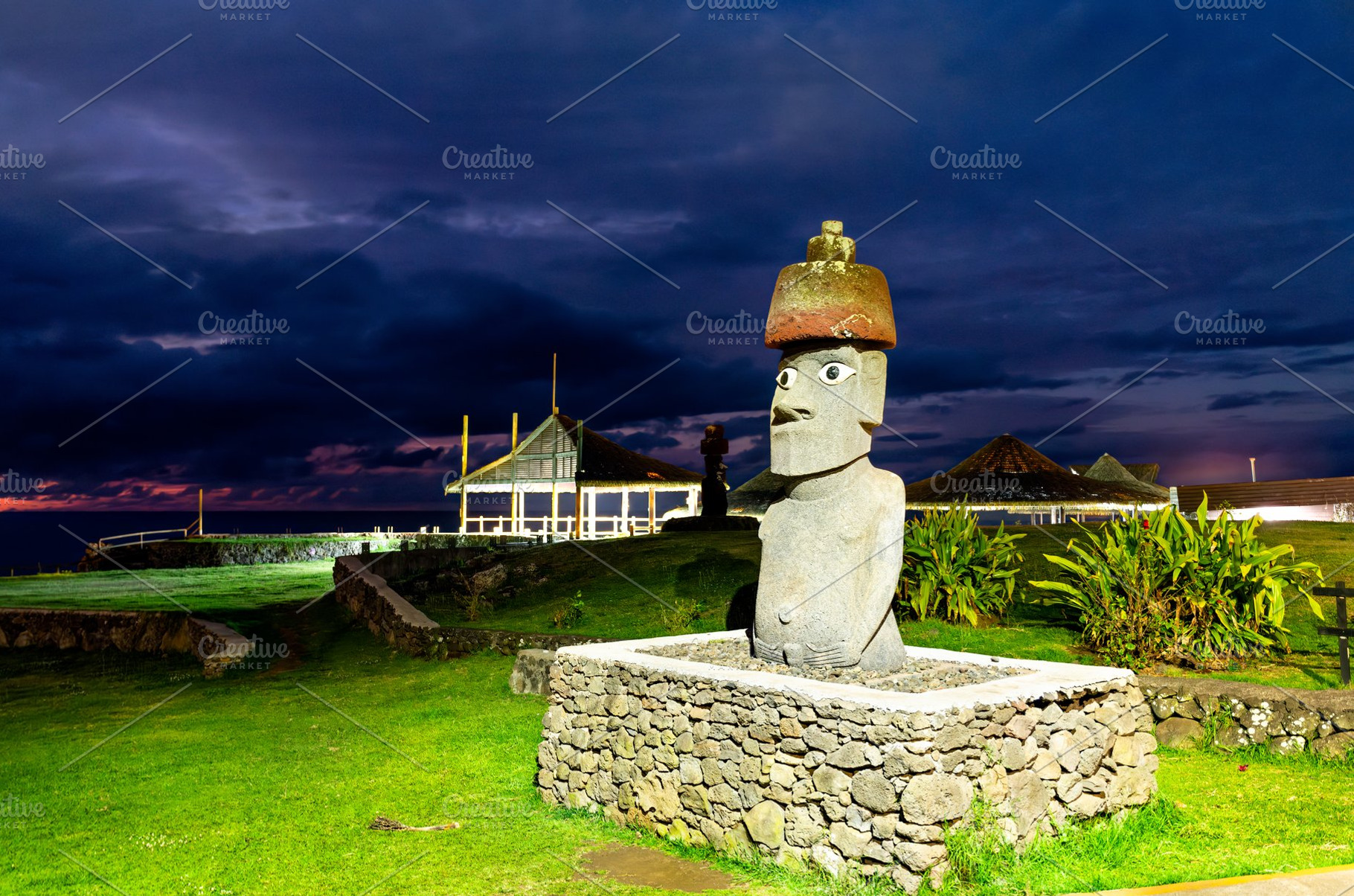 Illuminated Moai statue at Hanga Roa seaside on Easter Island, an Architecture Photo by Leonid Andronov