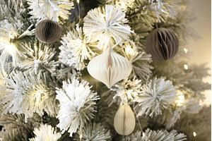 Flocked christmas tree with paper, a Holiday Photo by Anna Efetova