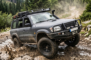 Rugged black off-road vehicle splash, a Transportation Photo by MistyDay