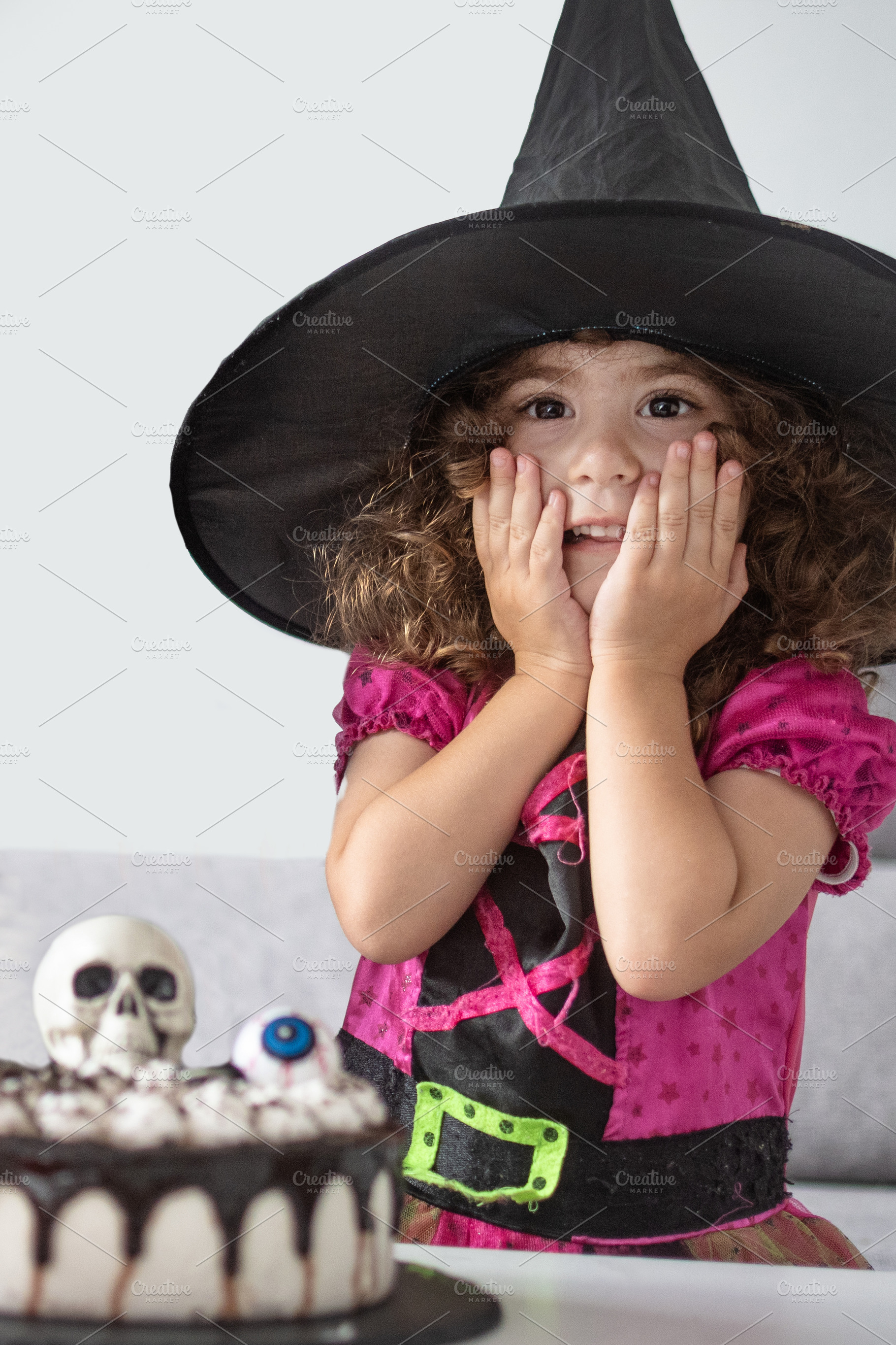 Little Girl in Witch Costume Surprised by Halloween Cake, a Food & Drink Photo by etorres69