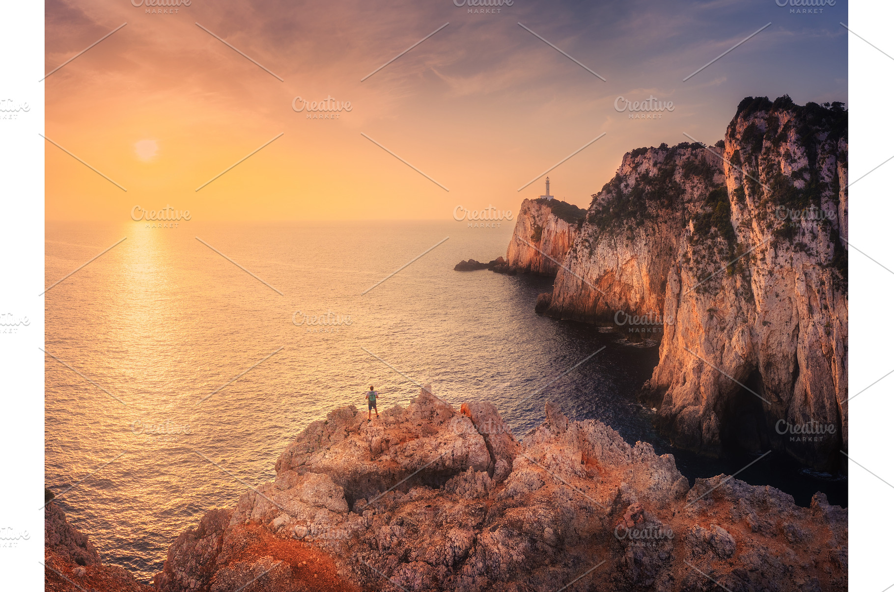 Aerial view of man on mountain peak, a Nature Photo by den-belitsky