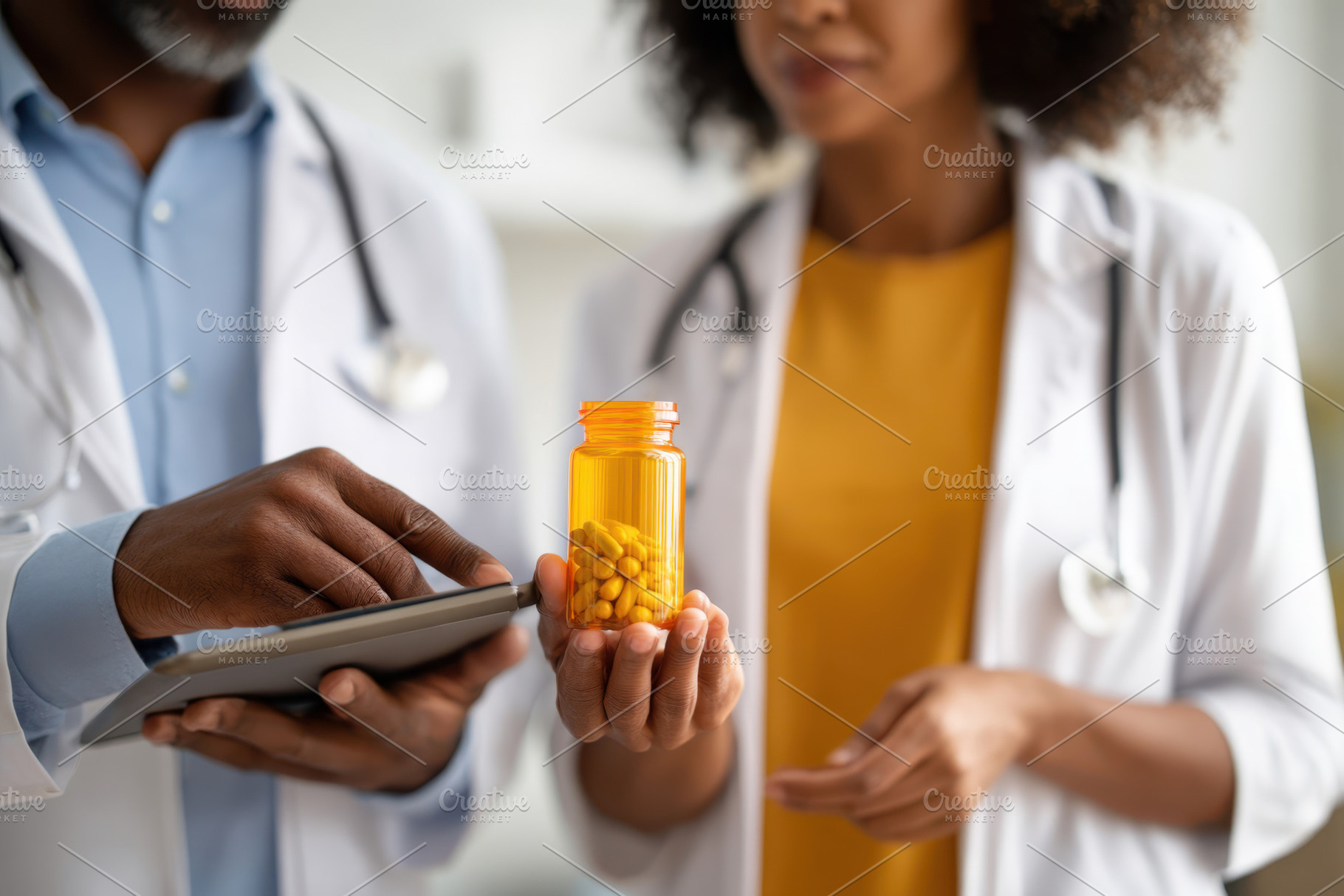 Healthcare professionals discussing medication, a Health & Medical Photo by AlyaAnd
