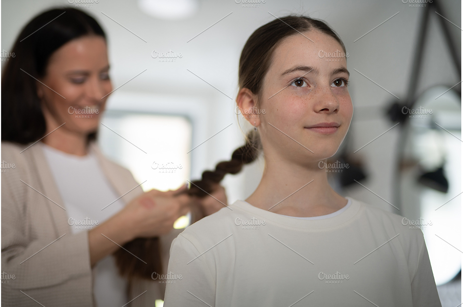 Mother braiding daughters thick hair, a Beauty & Fashion Photo by HalfPoint