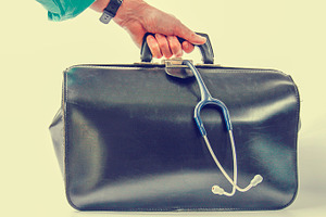 Doctor carrying medical bag