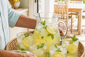 Refreshing lemonade pitcher with lem, a Photo by Dvoevnore photos