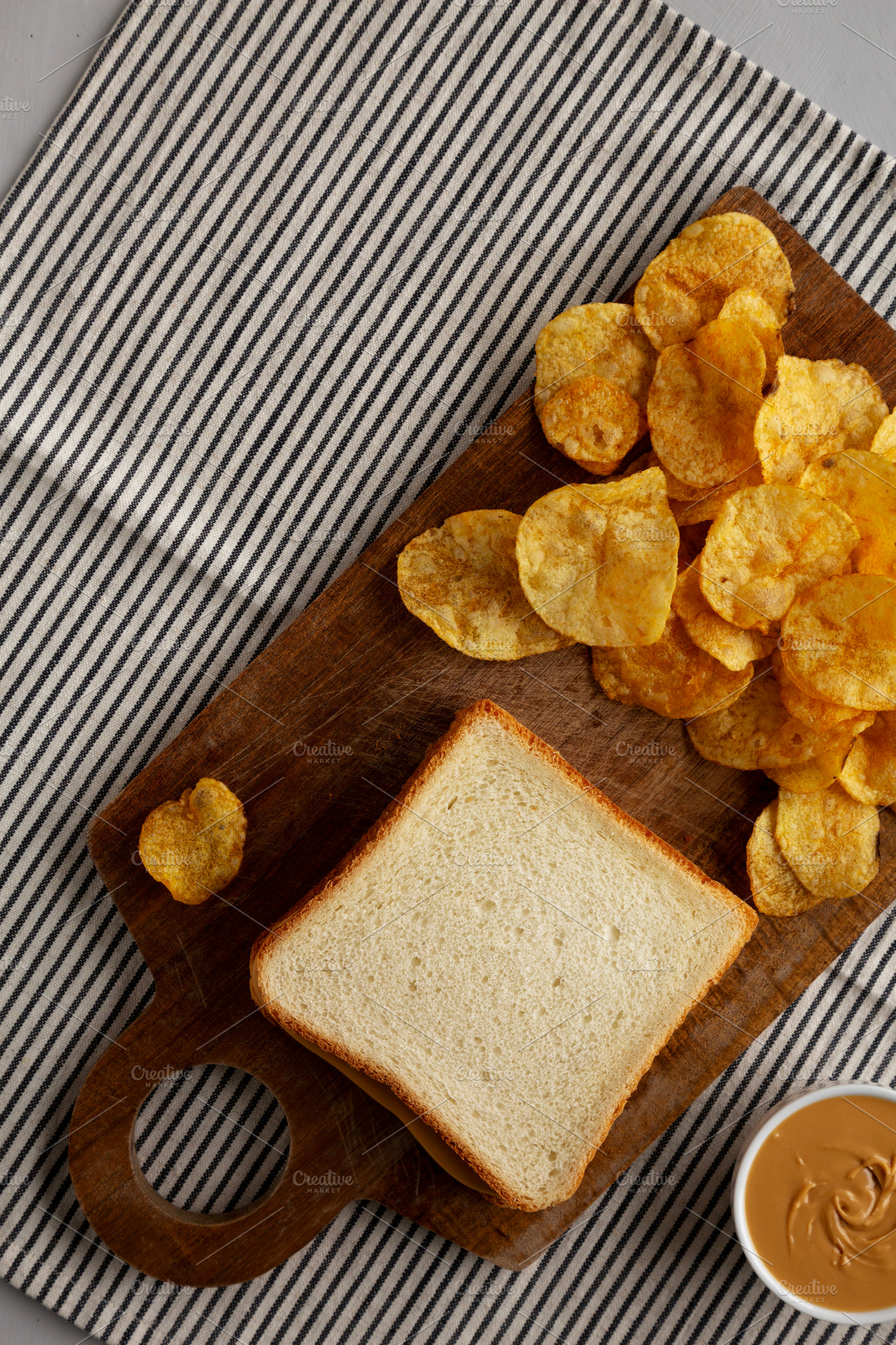 Homemade American Peanut Butter Sandwich on a Wooden Board, top, a Food & Drink Photo by LiudmylaChuhunova
