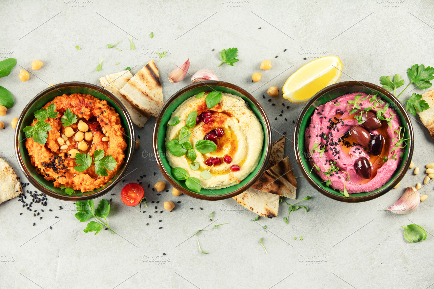Colorful Hummus Trio with Garnishes and Pita Bread, a Food & Drink Photo by Natalia Klenova's Shop