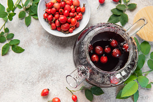 Rosehip herbal tea brewing in glass teapot, a Food & Drink Photo by Olena Rudo