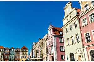 Traditional houses on the old market containing poland, poznan, and city, an Architecture Photo by Leonid Andronov