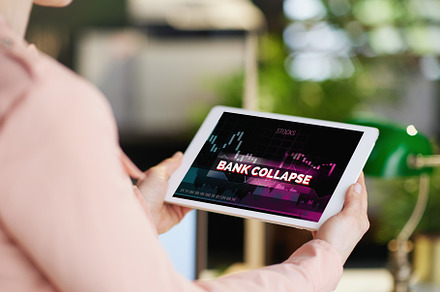 Closeup on business woman with tablet and bank collapse screen, a Business Photo by Alliance Images