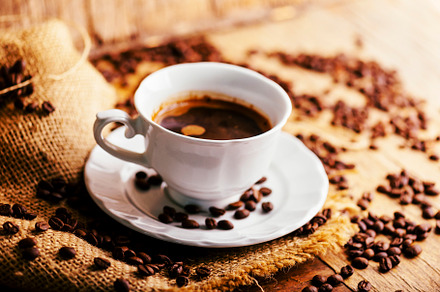 Closeup of coffee cup and coffee bea, a Food & Drink Photo by hitdelight