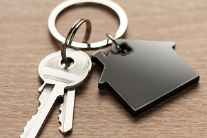 House keys with house shaped keychain on wood, a Business Photo by Olena Rudo