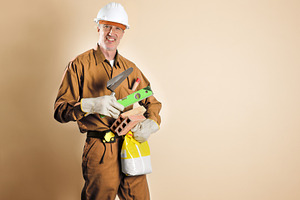 Smiling bricklayer holding tools and building materials brown is, a Person Photo by Davizro's Market