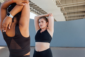 Two plus-size women practicing, a Person Photo by Artem Varnitsin