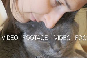 Woman Kissing Her Cat.