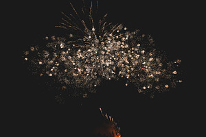 Fireworks in night sky containing abstract, background, and beautiful
