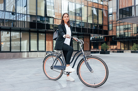 Stylish businesswoman with a bicycle