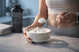 Person enjoying high-protein skyr yo, a Photo by Dvoevnore photos