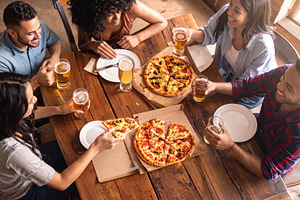 Friends Enjoying Pizza and Beer Together, a Photo by Davizro's Market
