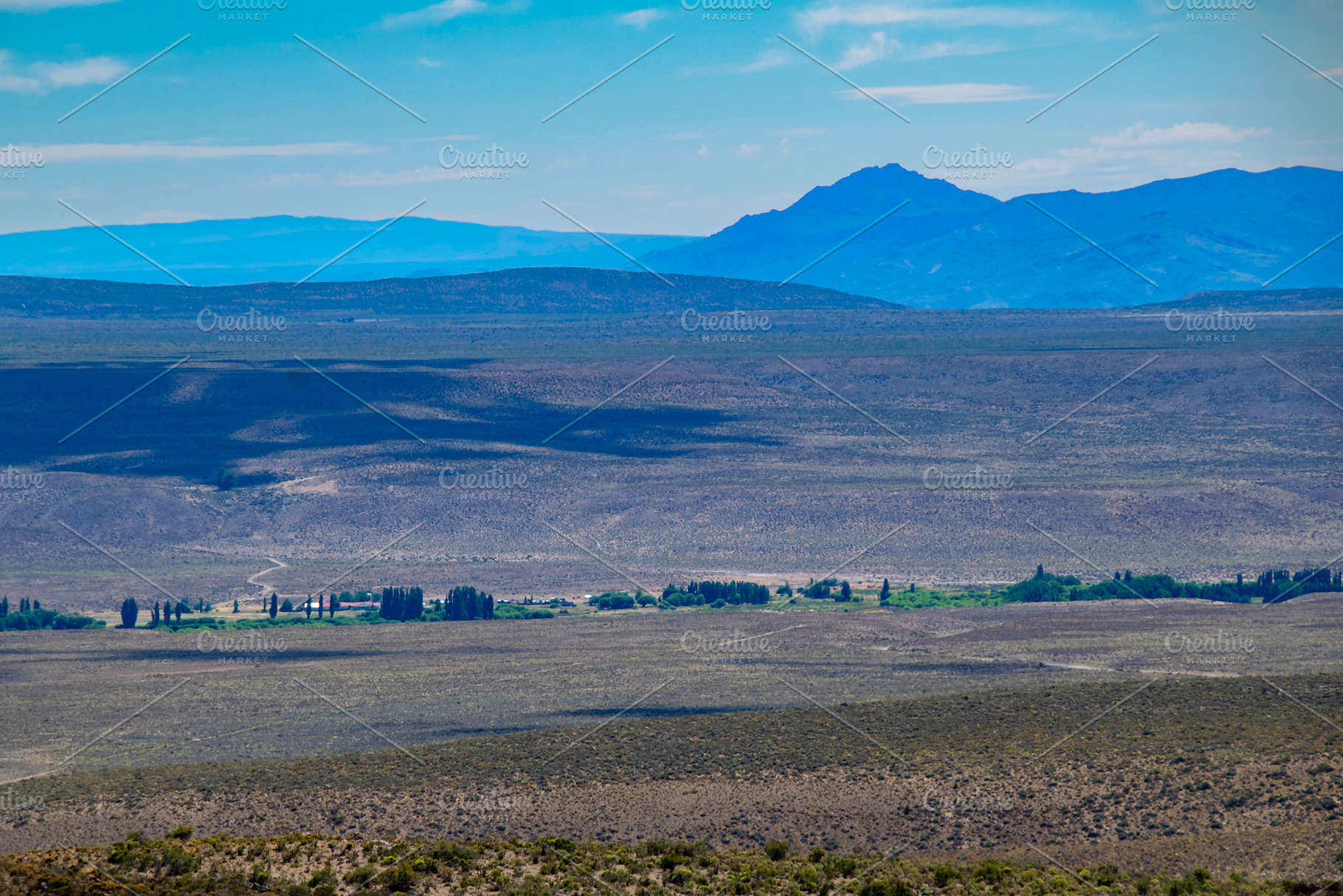 Steppe patagonia landscape and mountains range at background, ch, a Nature Photo by DanFLCreativo