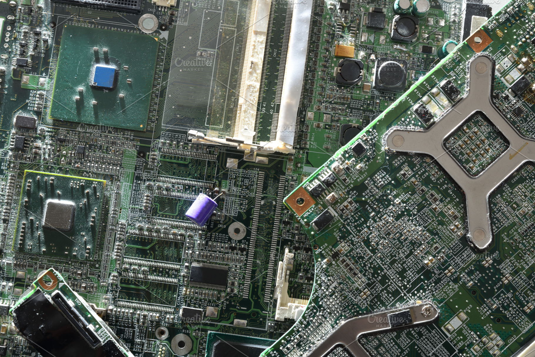 Damaged Obsolete Computer Motherboard Close-Up, a Technology Photo by Davizro's Market