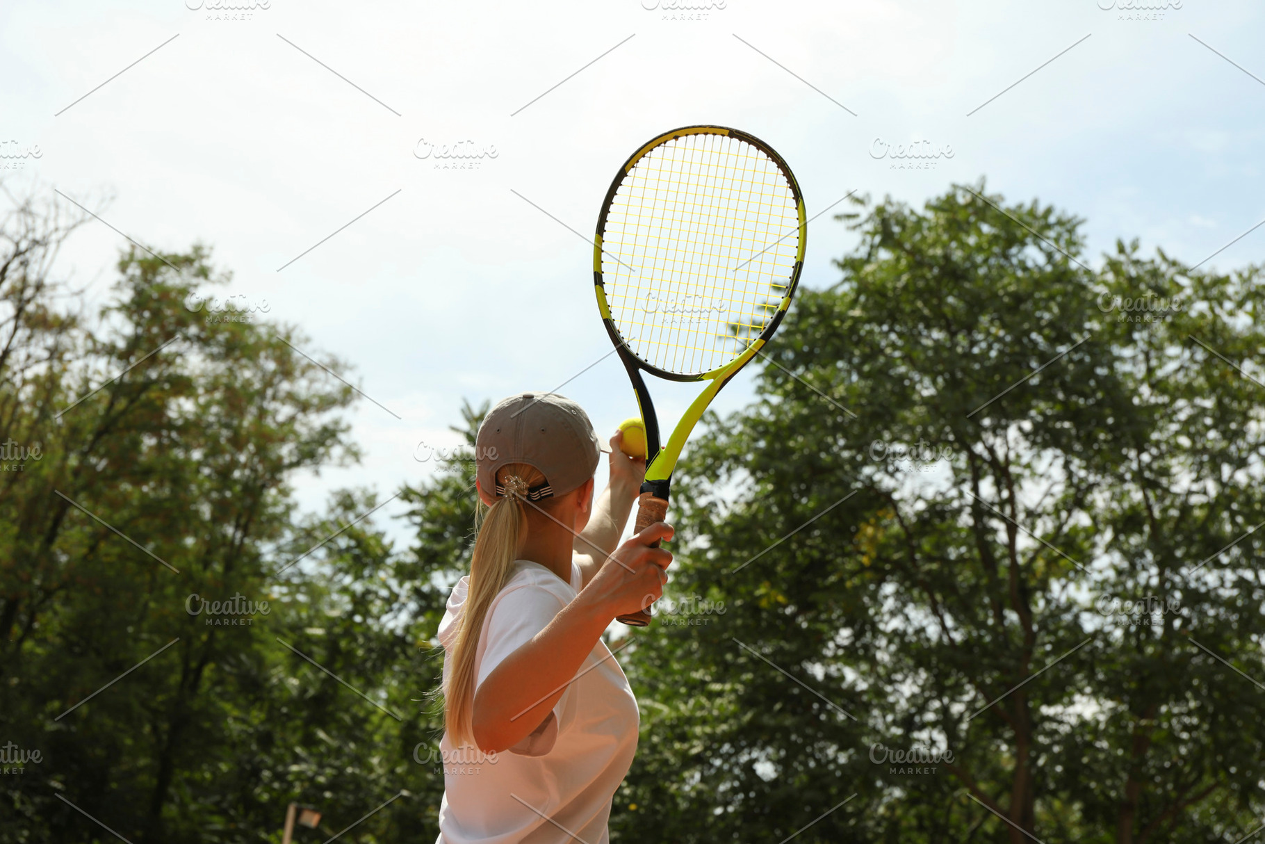 Young woman in white t-shirt serve the tennis ball, a Sports & Recreation Photo by AtlasStudio PRO