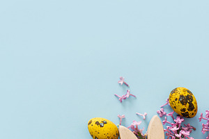 Happy Easter! Modern yellow eggs, bunny ears and lilac blossom f, a Holiday Photo by Sonjachni