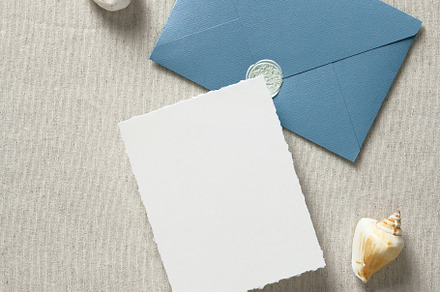 Wedding stationery in marine style. Flat lay blue envelope with wedding invitat, a Holiday Photo by photoguns