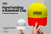 Hand Holding a Baseball Cap Mockup, an Apparel Mockup by Elite Mockups (Thumbnail 1 of 2)