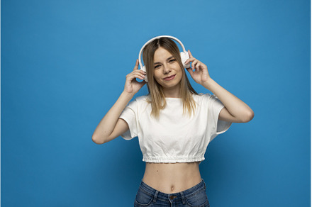Energy girl with white headphones, a Person Photo by volodymyrshtun13795