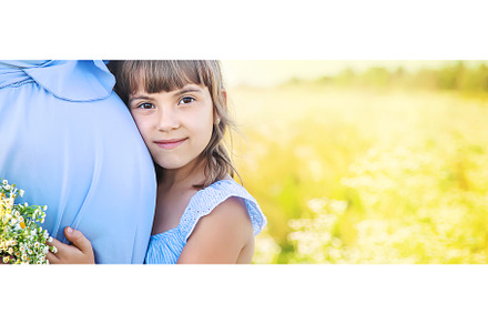 pregnant woman with daughter in a, a Person Photo by yanadjana