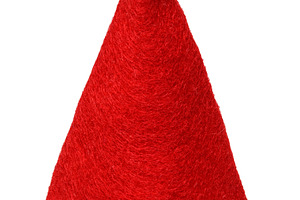 Red cone-shaped hat made of thick fleecy material with a white f, a Holiday Photo by ndanko
