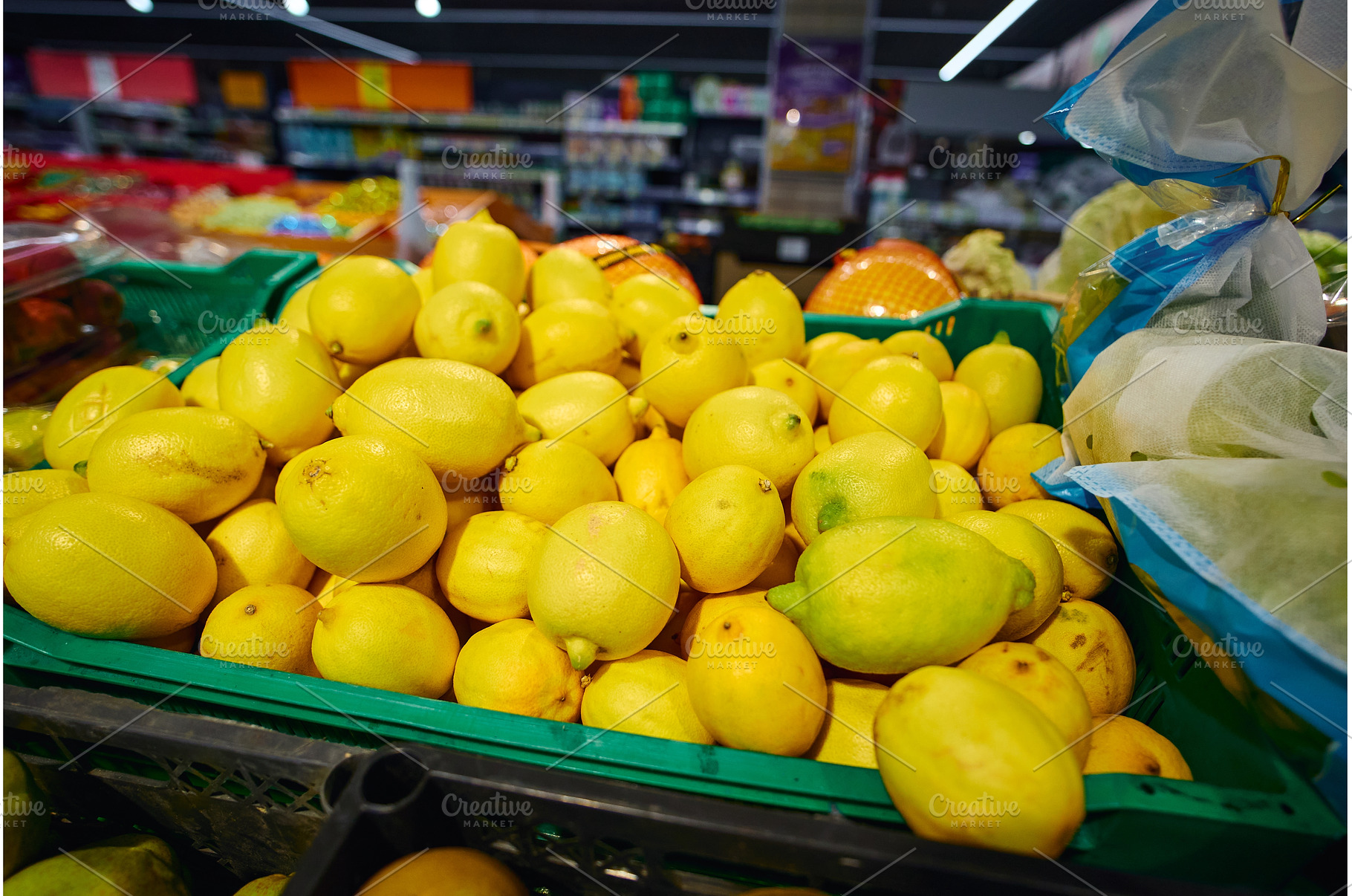Lemons are piled high in a green, a Food & Drink Photo by darksoul72